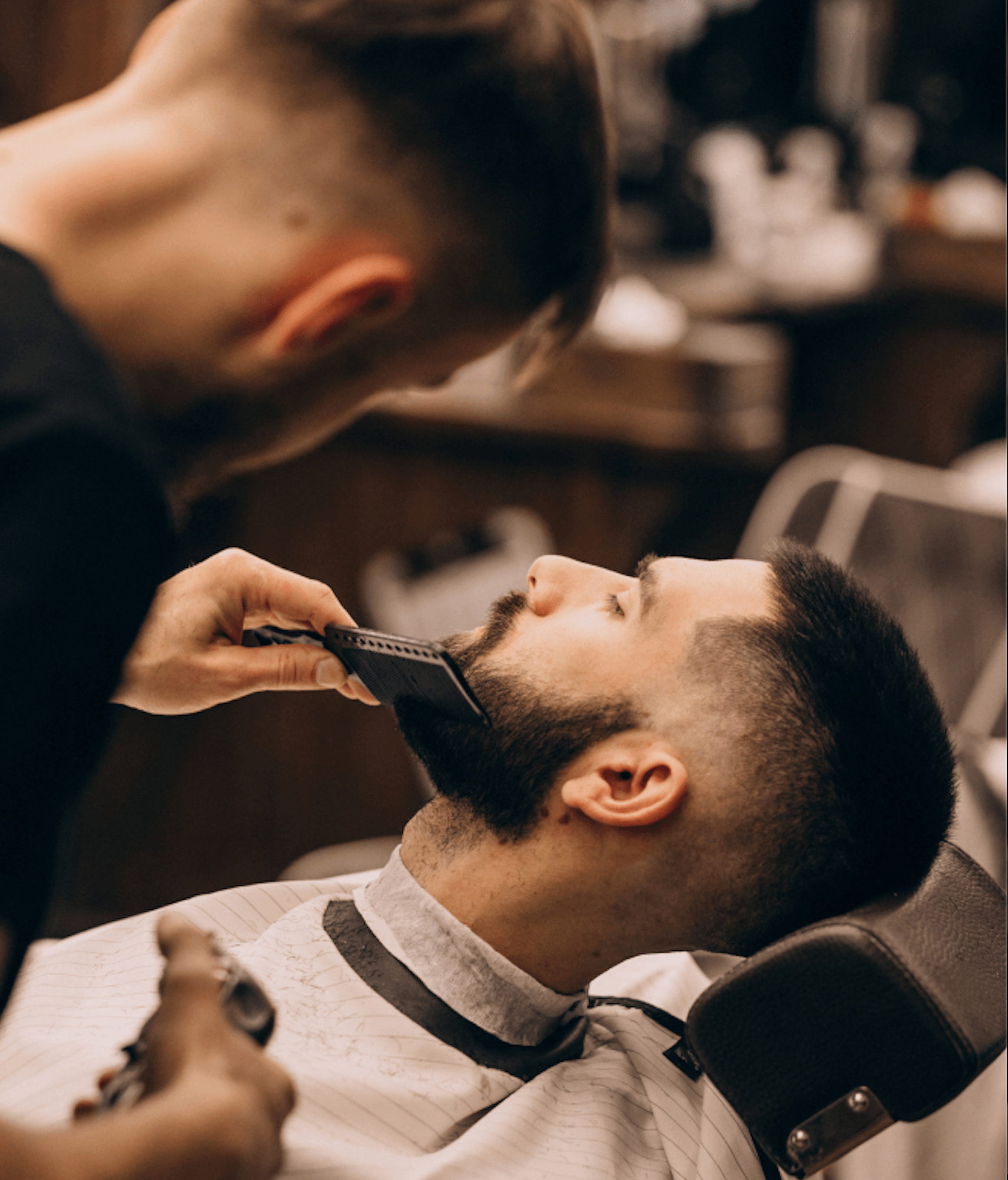 Barber mid-cut inside Iron & Comb